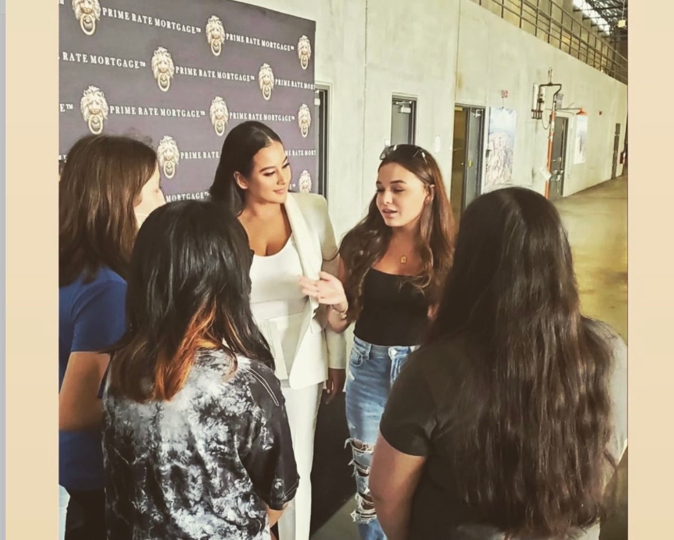 Talia Ramos speaking with young women at a Prime Rate Mortgage entrepreneurship event